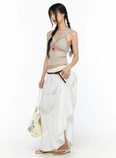 LEWKIN Layered Maxi Skirt CU530 white side shot on model with braided pigtails wearing floral cami top and brown braided belt holding bag