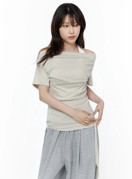 Layered Off-Shoulder Halter Top IL506 Beige close-up front shot on model showing folded off-shoulder neckline, draped fabric, and side tie detail