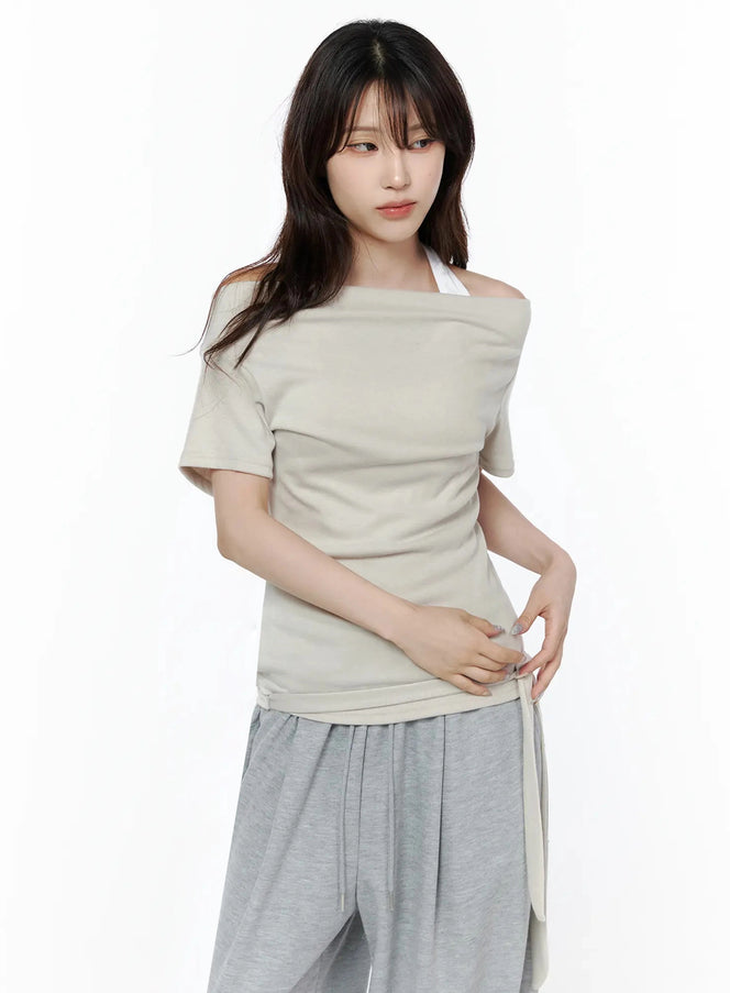 Layered Off-Shoulder Halter Top IL506 Beige close-up front shot on model showing folded off-shoulder neckline, draped fabric, and side tie detail