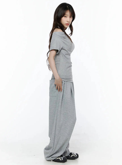Layered Off-Shoulder Halter Top IL506 Gray side shot on model showing fitted silhouette, folded shoulder detail, and wide-leg pants with side pocket