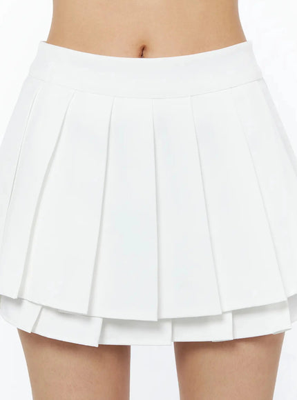 Layered Pleated Skirt IL509 White close-up front detail shot on model showing double-tiered pleated structure and wide waistband