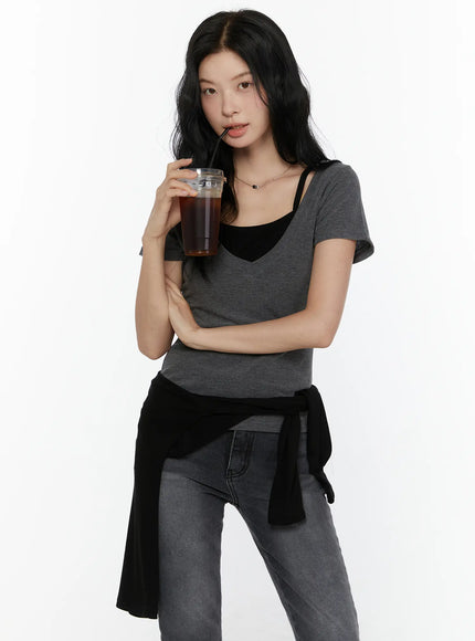 LEWKIN Layered Short Sleeve Tee CL521 Dark gray S/M half-body front shot on model holding iced coffee layered over black cami top with jeans