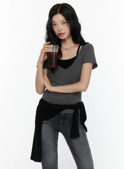 LEWKIN Layered Short Sleeve Tee CL521 Dark gray S/M half-body front shot on model holding iced coffee layered over black cami top with jeans