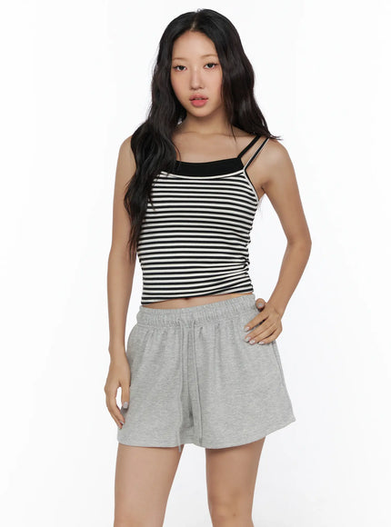 Layered Striped Cami Top CL513 Black close-up front view on model showing double spaghetti straps black neckline trim and horizontal stripe knit