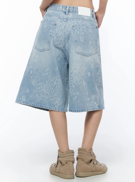 Leopard Print Jorts IU525 Light blue back view on model showing two rear patch pockets white brand label waistband tag and tonal leopard washed denim