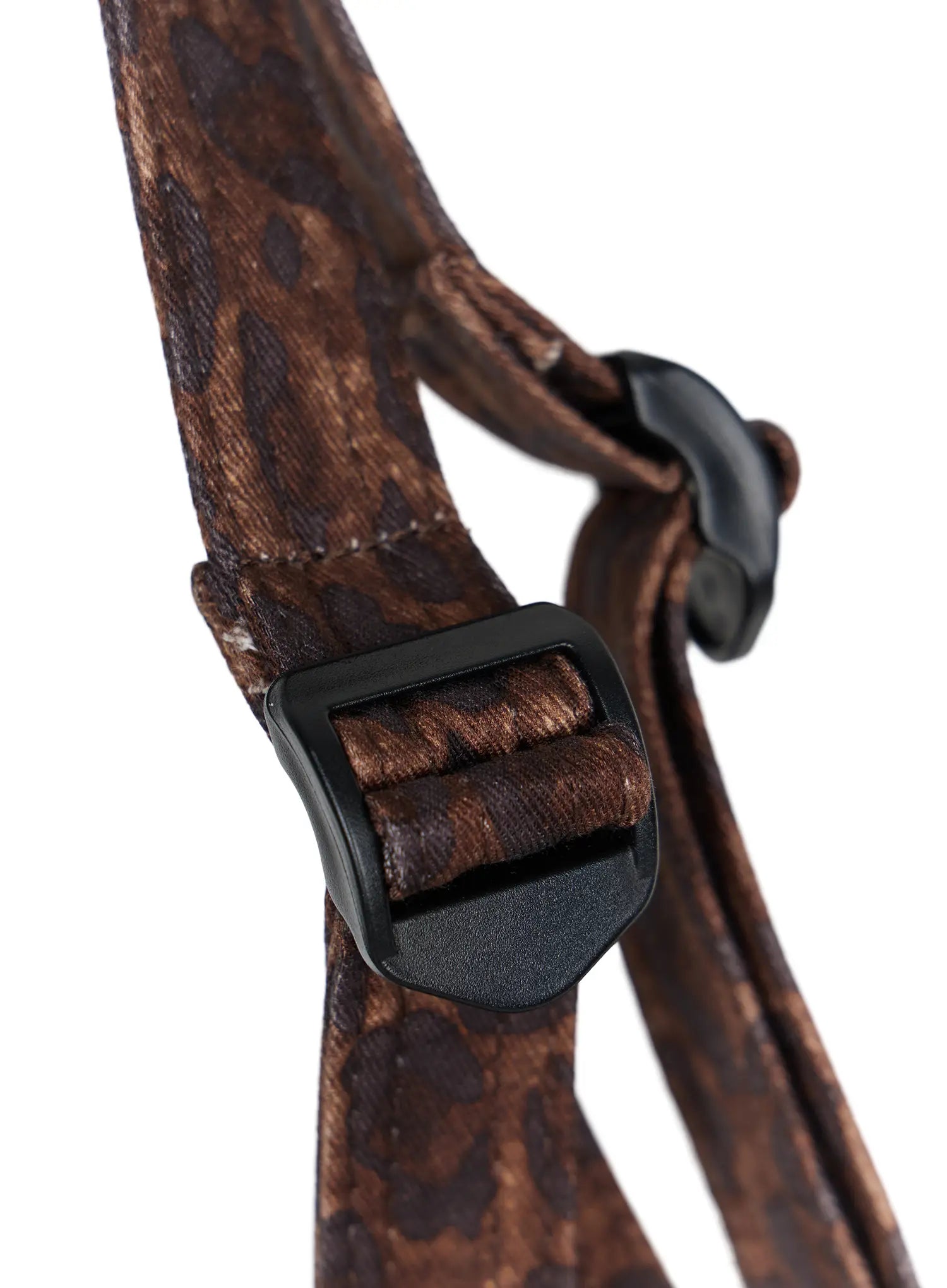 Leopard Print Sling Shoulder Bag CU524 Brown close-up detail shot of adjustable strap with black plastic slider buckle and clip hardware on leopard fabric