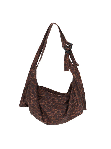 Leopard Print Sling Shoulder Bag CU524 Brown standalone product front shot on white background showing full crescent silhouette with strap and buckle detail