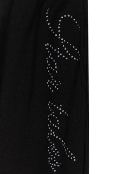 Lettering Contrast Waist Sweatpants IL515 Black close-up detail of gray star-dot script lettering graphic printed on black cotton fleece fabric, showing full graphic length
