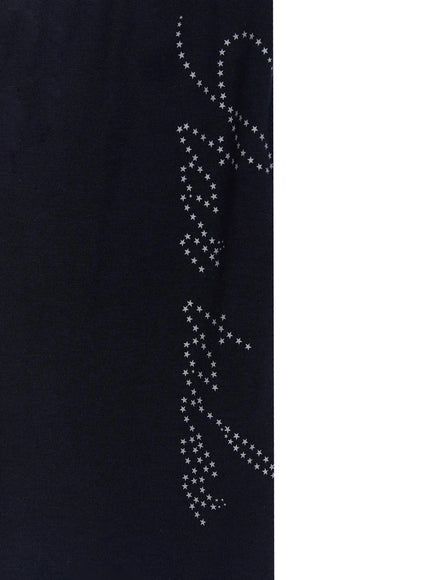 Lettering Contrast Waist Sweatpants IL515 Navy close-up detail of silver-gray star-dot script lettering graphic printed on dark navy cotton fleece fabric