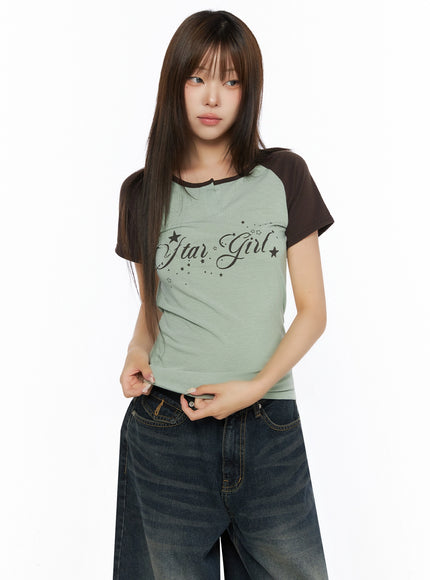 Lettering Raglan Slit Short Sleeve Tee IL515 Mint front torso shot on model showing Star Girl print notch slit neckline and dark brown raglan short sleeves