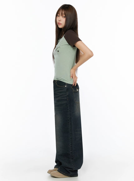 Lettering Raglan Slit Short Sleeve Tee IL515 Mint side shot on model hand on hip showing slim fit and dark brown raglan sleeves with wide-leg jeans