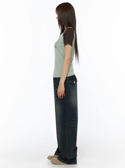 Lettering Raglan Slit Short Sleeve Tee IL515 Mint side profile full-body shot on model showing slim silhouette dark brown raglan sleeves and wide-leg jeans