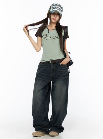 Lettering Raglan Slit Short Sleeve Tee IL515 Mint full-body front shot on model wearing cap leather bag and belt styled with wide-leg jeans hair tousled