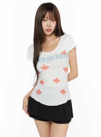 Lettering Wavy Slim T-Shirt IL515 White front shot on model with straight hair standing upright wearing black mini skirt showing curved hem detail