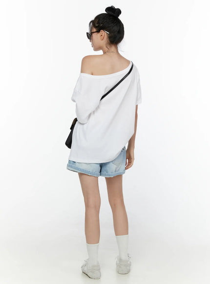 Light Washed Denim Shorts CL520 Light blue back shot on model full-body styled with white off-shoulder top black crossbody bag and sneakers