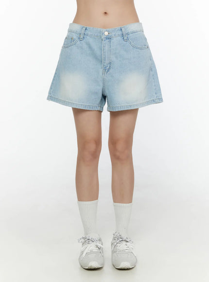 Light Washed Denim Shorts CL520 Light blue front shot on model standing straight showing wide-leg silhouette sun-faded thigh detail and silver button
