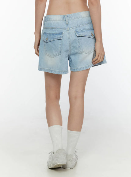 Light Washed Denim Shorts CL520 Light blue back shot on model showing flap back pockets faded wash and relaxed fit with white socks and sneakers