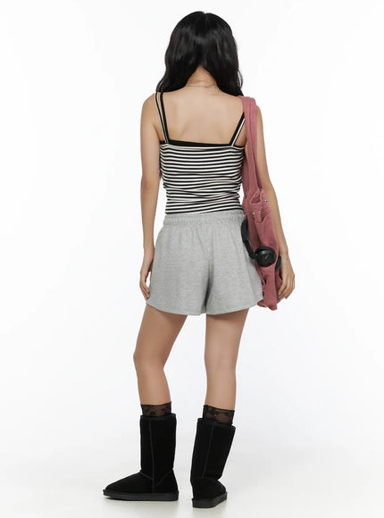 Lightweight Sweat Shorts CL513 Gray back shot on model styled with black-white striped cami pink bag and black UGG boots rear view