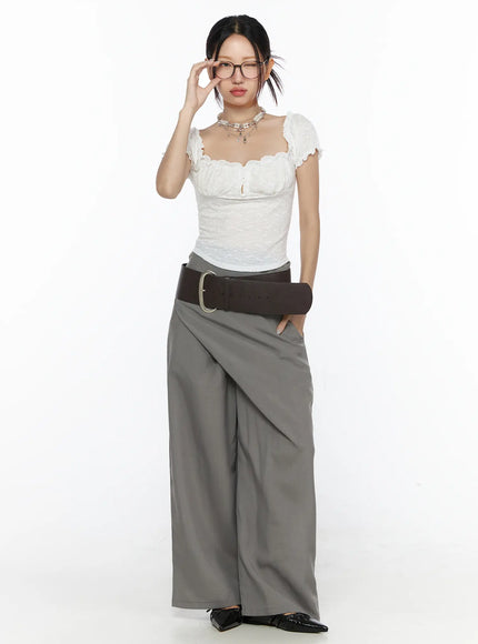 Linen Wrap Slacks CL527 Beige close-up detail of front wrap overlay and wide high waistband showing fabric texture and asymmetric fold
