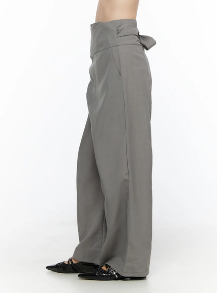 Linen Wrap Slacks CL527 Beige back close-up on model showing tie bow knot at high waist and full wide-leg cut with black patent pointed flats