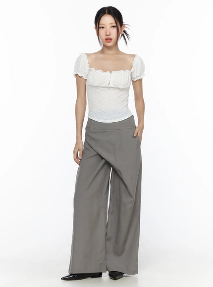 Linen Wrap Slacks CL527 Beige front full-body view on model standing upright showing asymmetric wrap overlay high waist styled with white lace top and black flats