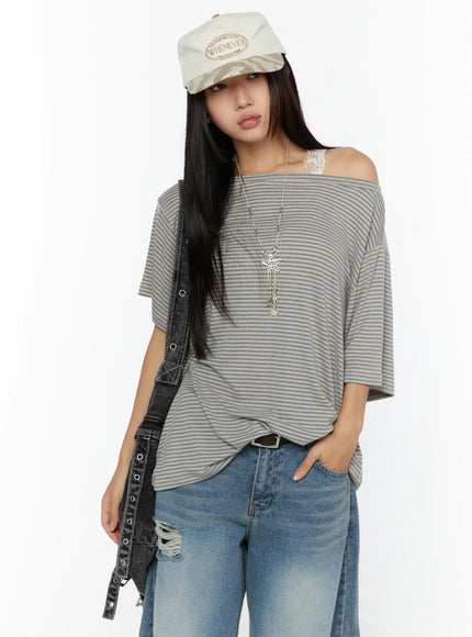 LEWKIN Loose Fit Striped Top CU526 Beige half-bust front shot on model wearing cap and necklace styled with ripped jeans and denim bag