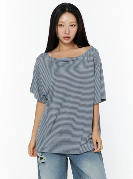Loose Fit Striped Top CU526 Beige front shot on model standing straight showing wide boat neckline and relaxed striped knit fabric