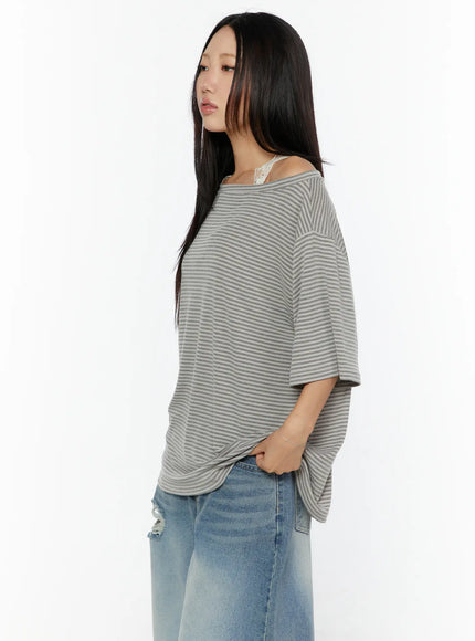 Loose Fit Striped Top CU526 Beige three-quarter side shot on model showing oversized drape and fine horizontal stripe texture