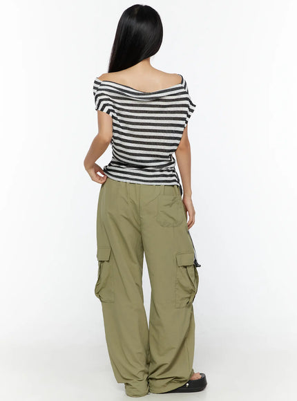 Loose Off-Shoulder Top CU526 Black back shot on model, off-shoulder back neckline, ribbed stripe knit, loose fit with side cinch tie