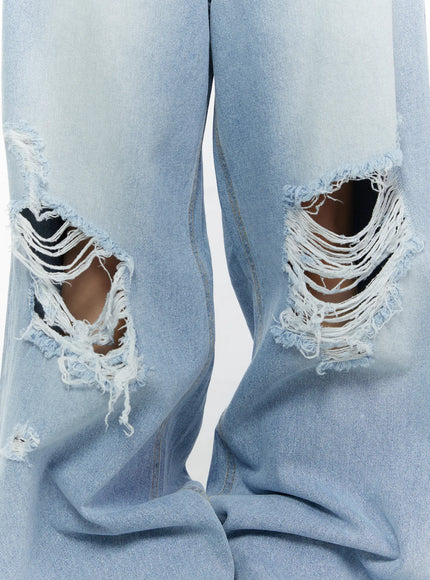 Lou Distressed Wide Leg Jeans CL508 Light blue close-up detail of large frayed knee rip distressing on both legs