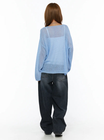 Louis Pintuck Washed Jeans CL503 Dark blue back view on model in blue mesh knit sweater, showing rear pockets and wide balloon leg pooling at hem