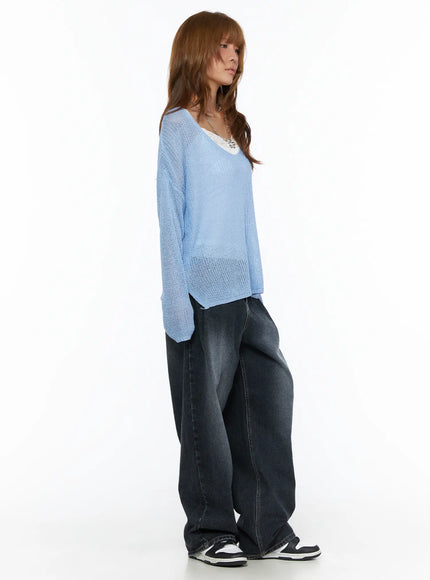 Louis Pintuck Washed Jeans CL503 Dark blue side view on model in blue sheer knit top, showing wide-leg volume and faded indigo denim texture