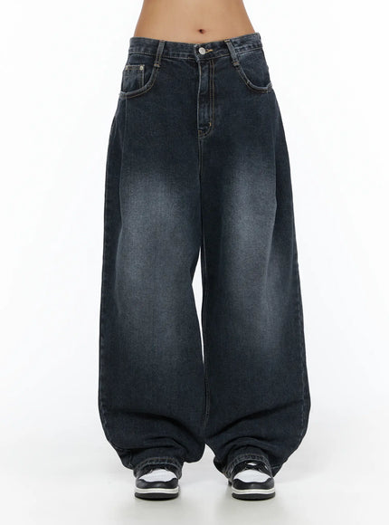 LEWKIN Louis Pintuck Washed Jeans CL503 Dark blue front view on model, low-rise waistband with button closure, wide-leg silhouette, faded wash denim, size S