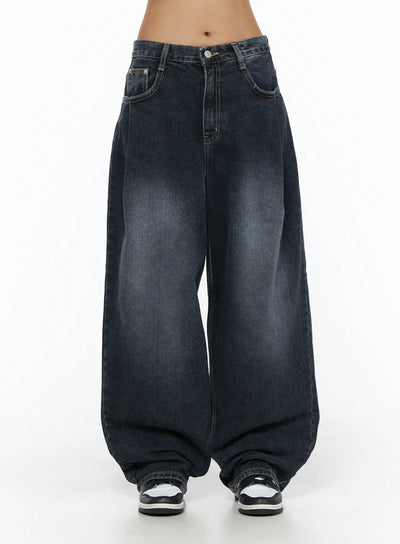 LEWKIN Louis Pintuck Washed Jeans CL503 Dark blue front view on model, low-rise waistband with button closure, wide-leg silhouette, faded wash denim, size S