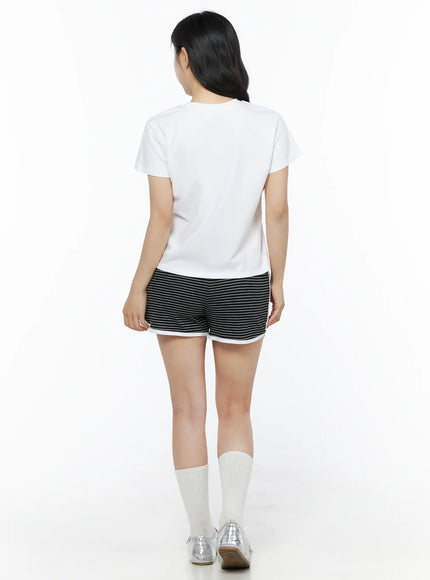 Lovely Bunny Graphic Tee IU525 White back shot on model showing plain clean back, crew neckline, and short sleeve cut paired with striped shorts