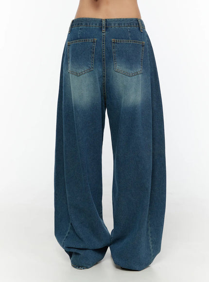 Lovi Washed Wide Leg Jeans CU526 Blue back view on model, dual back pockets with topstitching, dramatic wide flared legs bunching at hem in washed indigo denim