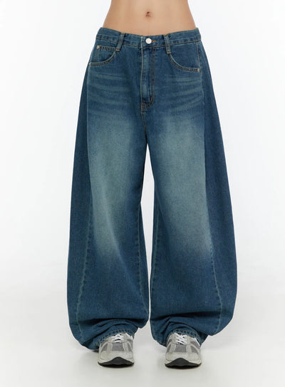 LEWKIN Lovi Washed Wide Leg Jeans CU526 Blue front view on model size S, low-rise waistband with white button, extreme wide-leg washed denim pooling at sneakers