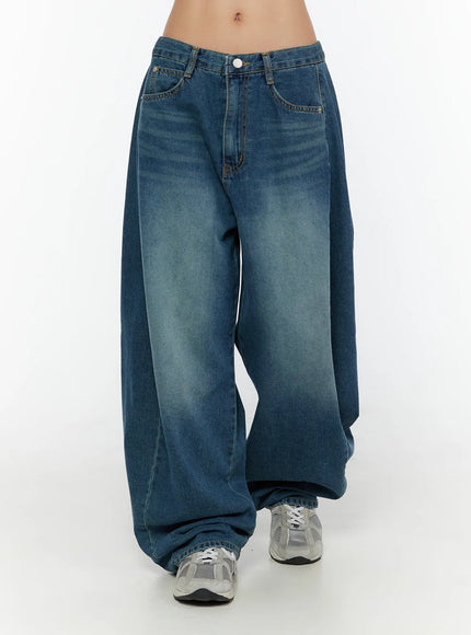 Lovi Washed Wide Leg Jeans CU526 Blue front view on model size S, fuller leg silhouette with prominent washed fade, white button waistband and pooled hem on sneakers