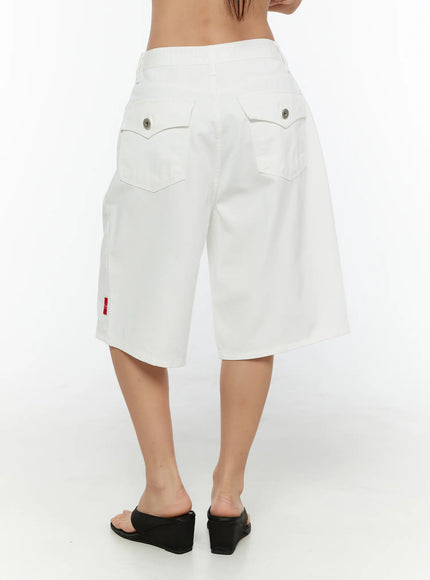 Low-Rise Cotton Shorts CU529 White back view on model showing two snap-button flap pockets red TWS label and wide-leg silhouette with wedge sandals