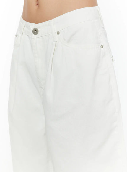 Low-Rise Cotton Shorts CU529 White close-up detail of asymmetric low-rise waistband with silver snap button and rivet hardware on cotton fabric