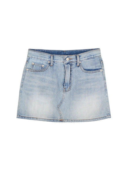 Low-Rise Denim Mini Skirt IL502 Light blue flat-lay front view showing button closure, front pockets, diagonal seam and faded wash denim on white background