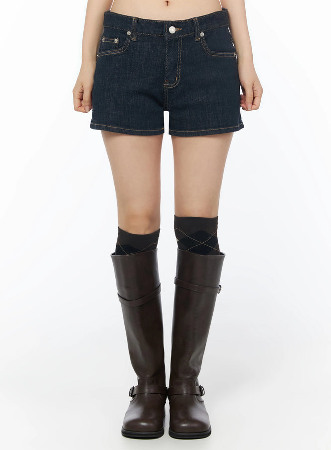 LEWKIN Low-Rise No-Fade Denim Shorts IU525 Dark blue front crop shot on model wearing knee-high boots, gold contrast stitching, silver button