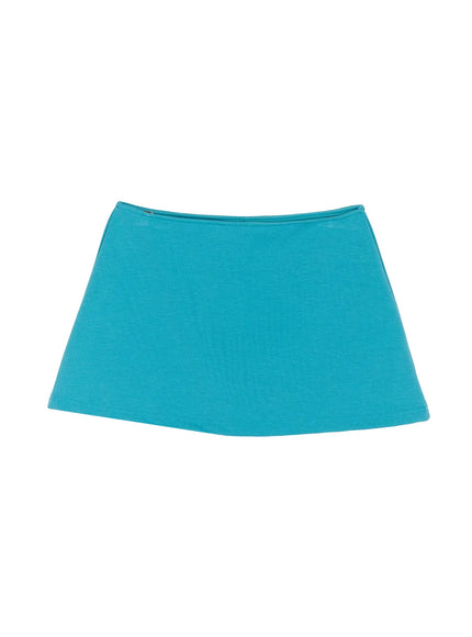 Low-Rise Skort IL509 Blue flat-lay front view showing teal cotton jersey fabric, low-rise folded waistband and A-line silhouette