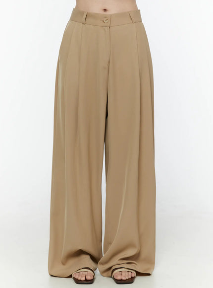 LEWKIN Low-Rise Wide Leg Tailored Pants IL506 Beige front view on model cropped at waist showing pleated wide-leg silhouette button closure and belt loops