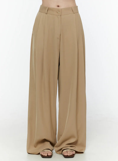 LEWKIN Low-Rise Wide Leg Tailored Pants IL506 Beige front view on model cropped at waist showing pleated wide-leg silhouette button closure and belt loops