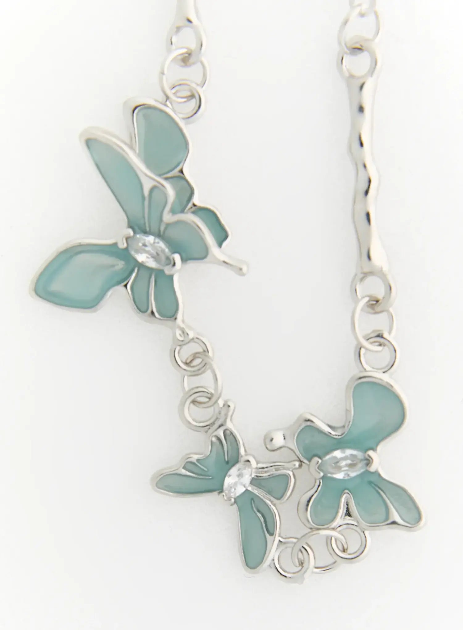LEWKIN Luna Butterfly Style Necklace IL517 mint blue close-up detail of dual enamel butterfly charms with crystal centers on silver chain