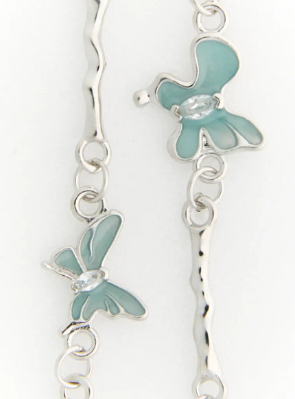 Luna Butterfly Style Necklace IL517 mint blue close-up detail showing multiple enamel butterfly charms and hammered bar links on silver chain