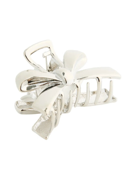 Luna Ribbon Hair Clip IL503 Silver angled front view displaying sculptural ribbon bow design with glossy chrome finish and claw structure