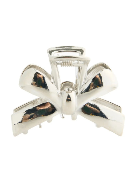 Luna Ribbon Hair Clip IL503 Silver front-facing close-up showing symmetrical ribbon bow silhouette and mirror-polished chrome claw center