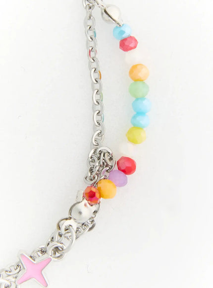 Lyra Star Crystal Necklace IL517 multicolor close-up detail of rainbow faceted crystal bead strand with pink enamel star charm and silver rolo chain connector